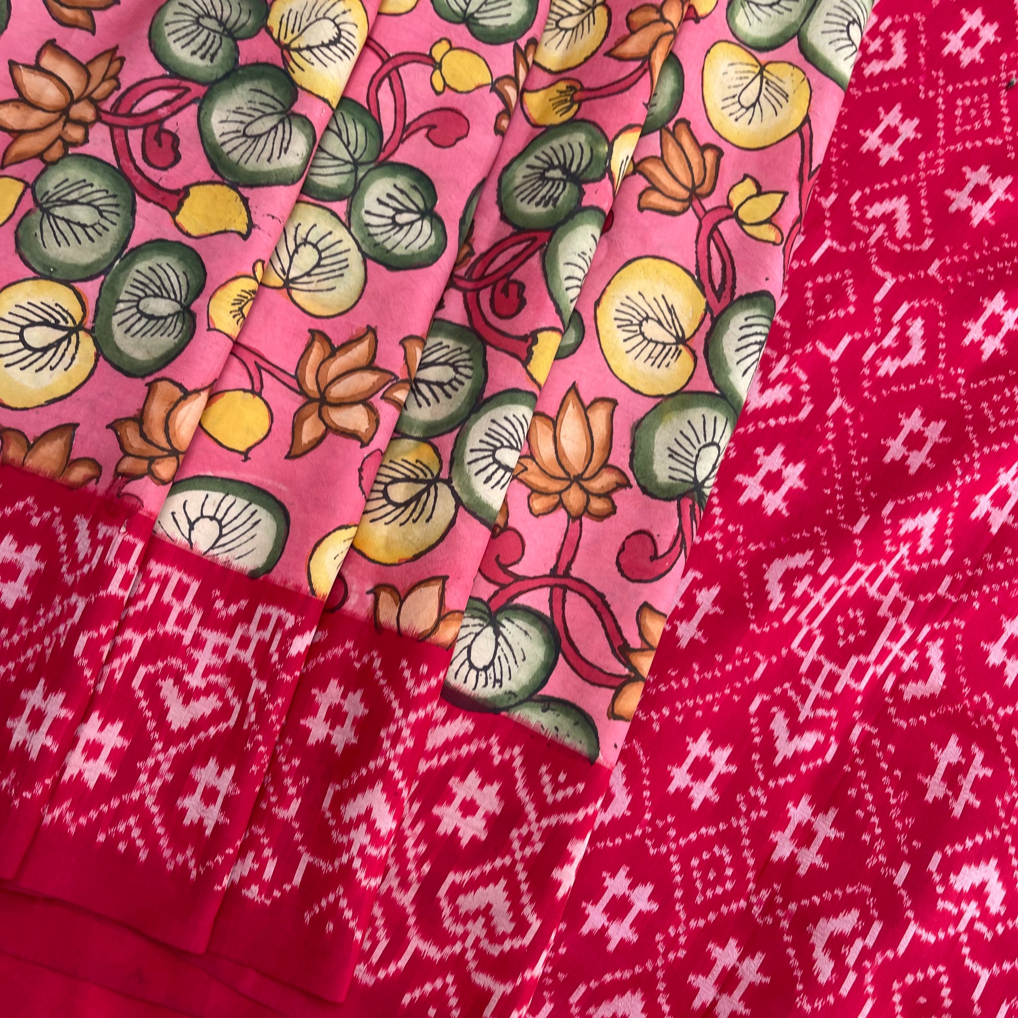 Hand-Painted Kalamkari Ikkat Silk Saree – Pink Base with Golden Lotus, Yellow Flowers & Green Leaves | Pure Handloom | Blouse Included